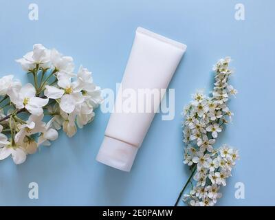 Mockup of white bottle plastic tube with facial moisturizer cream or facial cleanser. Space for your cosmetic and makeup products. Concept bio organic Stock Photo