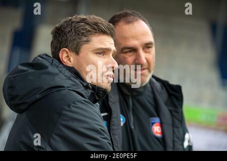 Heidenheim, Germany. 02nd Jan, 2021. Football: 2nd Bundesliga, 1. FC Heidenheim - 1. FC Nürnberg, Matchday 14 at the Voith Arena. Coaches Robert Klauß (Nürnberg, l) and Frank Schmidt (Heidenheim) look at the pitch. Credit: Stefan Puchner/dpa - IMPORTANT NOTE: In accordance with the regulations of the DFL Deutsche Fußball Liga and/or the DFB Deutscher Fußball-Bund, it is prohibited to use or have used photographs taken in the stadium and/or of the match in the form of sequence pictures and/or video-like photo series./dpa/Alamy Live News Stock Photo