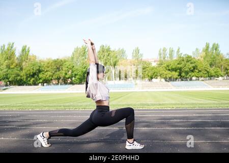 Fitness sporty woman during outdoor exercises workout. copy space. Weight Loss. Healthy lifestyle. Sporty healthy female. Stock Photo
