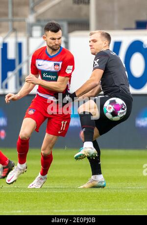 Heidenheim, Germany. 02nd Jan, 2021. Football: 2. Bundesliga, 1. FC Heidenheim - 1. FC Nürnberg, Matchday 14 at Voith Arena. Heidenheim's Denis Thomalla (l) and Nürnberg's Johannes Geis fight for the ball. Credit: Stefan Puchner/dpa - IMPORTANT NOTE: In accordance with the regulations of the DFL Deutsche Fußball Liga and/or the DFB Deutscher Fußball-Bund, it is prohibited to use or have used photographs taken in the stadium and/or of the match in the form of sequence pictures and/or video-like photo series./dpa/Alamy Live News Stock Photo