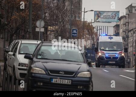 BELGARDE, SERBIA - DECEMBER 19, 2020: Serbian ambulance from the hitna pomoc services, a van, driving on a street heading for emergency intervention i Stock Photo