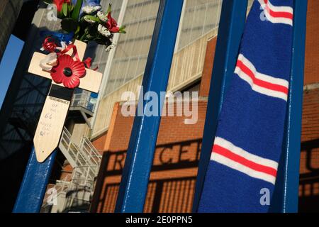 Glasgow, UK, 2 January 2021. Supporters of Rangers Football Club tie scarves on the club's stadium gate, in memory of those 66 fans who lost their life in the Ibrox Stadium disaster which happened 50-years ago today on 2nd January 1971. The anniversary falls on the day that Rangers FC plays their rivals Celtic FC, at home, in a League game. Photo: JeremyS utton-Hibbert/Alamy Live News. Stock Photo