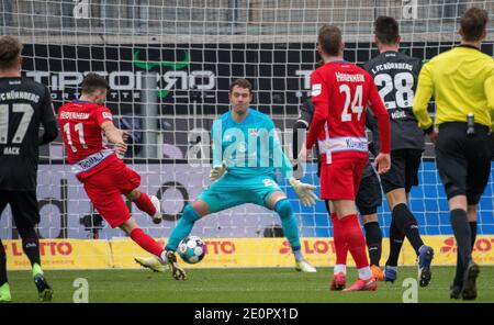 Heidenheim, Germany. 02nd Jan, 2021. Football: 2. Bundesliga, 1. FC Heidenheim - 1. FC Nürnberg, Matchday 14 at Voith Arena. Heidenheim's Denis Thomalla (l) scores the 1:0 against Nürnberg's goalkeeper Christian Mathenia. Credit: Stefan Puchner/dpa - IMPORTANT NOTE: In accordance with the regulations of the DFL Deutsche Fußball Liga and/or the DFB Deutscher Fußball-Bund, it is prohibited to use or have used photographs taken in the stadium and/or of the match in the form of sequence pictures and/or video-like photo series./dpa/Alamy Live News Stock Photo