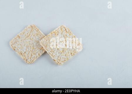 Two delicious airy crispbread on white background Stock Photo