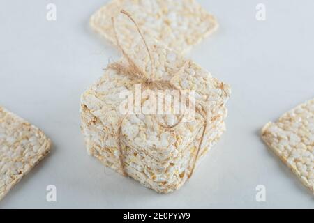 Stack of delicious airy crispbread on white background Stock Photo