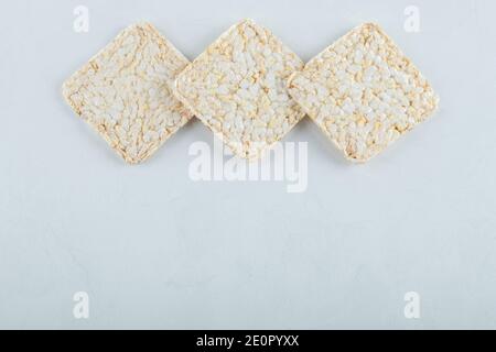 Delicious airy crispbread on white background Stock Photo