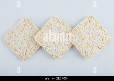 Delicious airy crispbread on white background Stock Photo