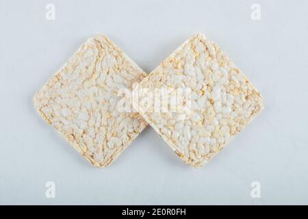 Two delicious airy crispbread on white background Stock Photo