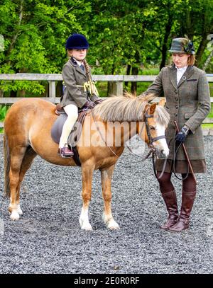 Inchcoonans Equestrian is Perthshire’s Premier Competition Yard & Livery Facility. Inchcoonans is situated between the Royal Burgh of Perth which is on the outskirts of the small historical village of Errol. On the 21st May 2017, a wet and rainy day various classes of prize horses from around Tayside and Perth & Kinross are paraded around then take part in the equestrian competitions in Scotland, UK Stock Photo