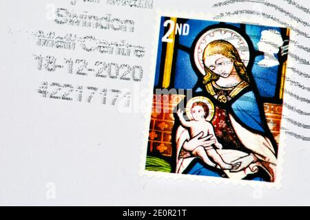 Royal Mail used Christmas 2nd Class Stamp feature the Adoration of the Magi stained-glass window from St Andrew’s Church in East Lexham Stock Photo