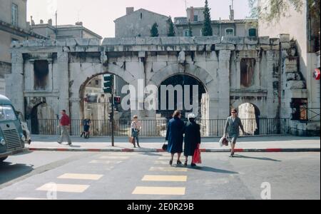 Nîmes, a city in the Occitanie region of southern France, important outpost of the Roman Empire, Roman remains. The Augustan Gate (Porte Auguste). Archival scan from a slide. April 1971. Stock Photo