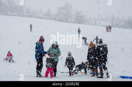 Downham, Clitheroe, Lancashire, UK. 2nd Jan, 2021. A snow storm on Pendle Hill near Downham, Clitheroe, Lancashire surprised people sledging and walkers . Credit: John Eveson/Alamy Live News Stock Photo