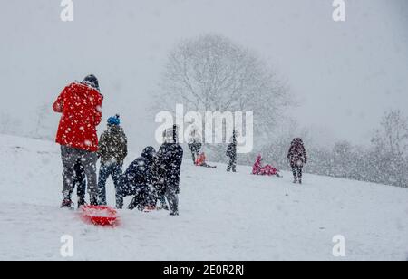 Downham, Clitheroe, Lancashire, UK. 2nd Jan, 2021. A snow storm on Pendle Hill near Downham, Clitheroe, Lancashire surprised people sledging and walkers . Credit: John Eveson/Alamy Live News Stock Photo