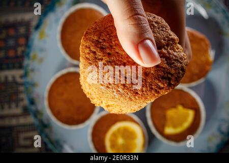 Girl holding fresh cupcake in her hand Stock Photo