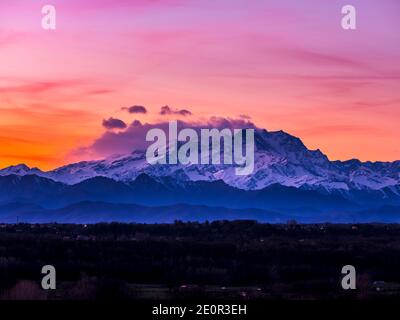 View of the Lombard Alps, the Monte Rosa chain shrouded in clouds at ...