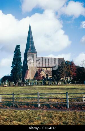 The Church of England parish church of St. Peter ad Vincula located in Wisborough Green, West Sussex. Archival scan from a slide. April 1977. Stock Photo
