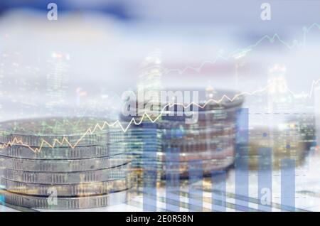 rows of coins for finance and graph double exposure of city business concept