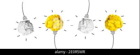 Creativity inspiration, ideas concepts with lightbulb from paper crumpled ball Stock Photo
