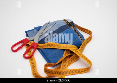 Scissors and made in Italy fabric Scissors and made in Italy fabric on white background Stock Photo