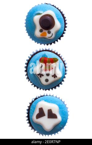 Snowmen cupcakes cup cakes in a row, in a line, from box of M&S 9 mini festive cupcakes isolated on white background - ideal for Christmas Xmas Stock Photo