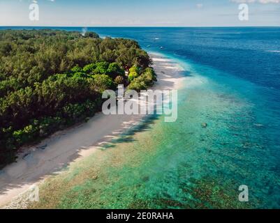 Tropical beach with out people and turquoise ocean at Gili Meno. Aerial drone view. Stock Photo