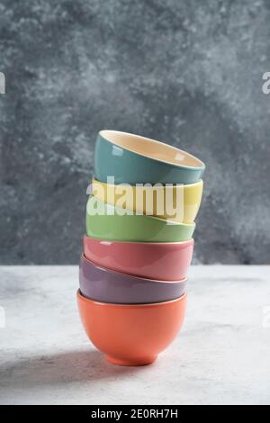 Many of colorful bowls on a gray background Stock Photo