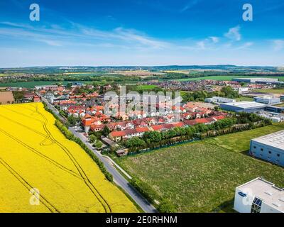 Nupaky, Czech republic - May 08, 2019. Small village near Prague with new row houses with old part of village in background and industrial part around Stock Photo