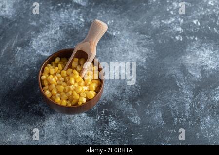 Bowl of sweet corns on marble background Stock Photo