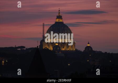 Saint Peter Basilica night view. The cupola of the Dome of Saint Peter Basilica at beautiful sunset light, Rome, Italy Stock Photo