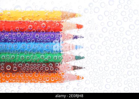 Colored pencils in air bubbles Stock Photo