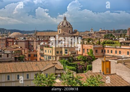 Rooftop view of the city skyline of Rome.Colorful vintage houses with terraces in Rome center. View of old beautiful architecture of Rome city, Italy Stock Photo