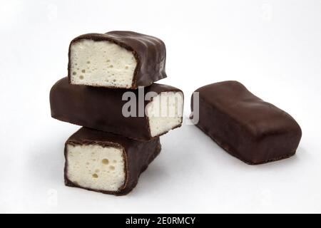 Soft marshmallow covered with chocolate. Original name literally mean 'bird's milk' (in Polish: ptasie mleczko). White background. Stock Photo