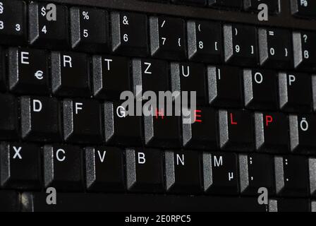 help diagonally in red writing on a computer keyboard Stock Photo