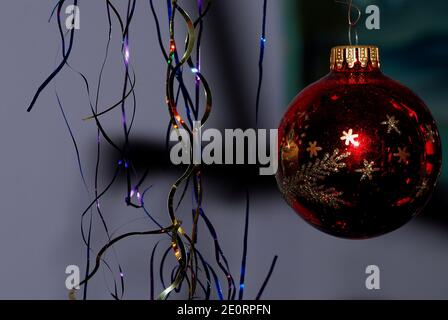 red Christmas balls and tinsel with stars for Christmas Stock Photo