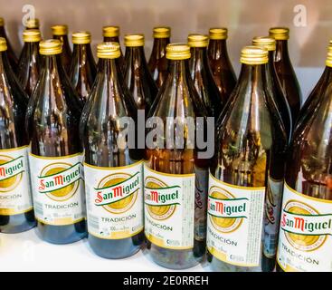 San Miguel beer bottles on shelf in supermarket in Mallorca Spain. Stock Photo