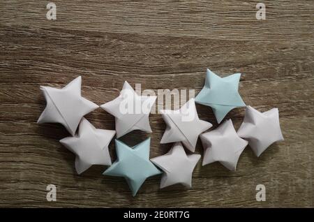 Colorful Origami Paper Stars on wooden Stock Photo