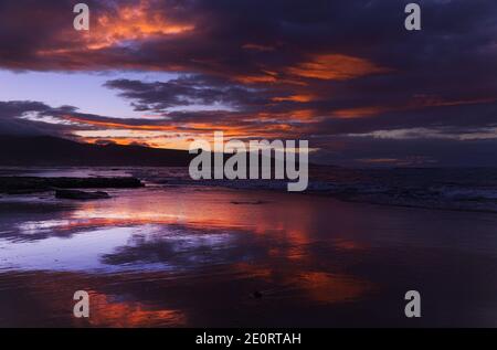 Beautiful sunset over Las Canteras beach in Las Palmas de Gran Canaria Stock Photo