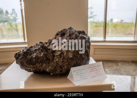 The Yardimly Meteorite (1959) exposition in the museum at the Shamakhi Astrophysical Observatory, two-metre reflecting telescope in Pirqulu village, Azerbaijan. The instrument was produced in Germany. It was installed in 1964 and become the first telescope of the South Caucasus. The first observation with the telescope was made in 1966. In 2008 the telescope was upgraded and the building was repaired. Stock Photo