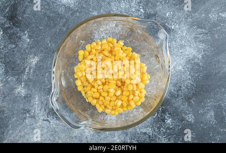 Heap of sweet corns in glass bowl Stock Photo