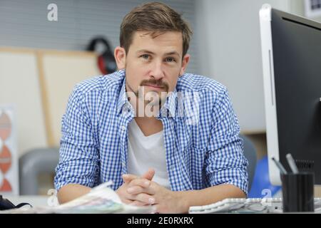 joyful confident businessman is enjoying espresso doing his job Stock Photo