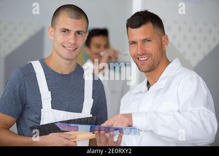 portrait of tutor and students on decorating course Stock Photo
