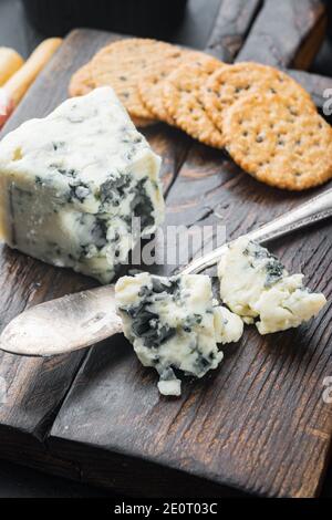 Slice of danish blue cheese, on black background Stock Photo