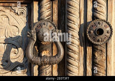 Ornamental door handle on old carved wood panel door knocker detail of the historic St. Alexander Nevsky Orthodox Cathedral church in Sofia Bulgaria Stock Photo