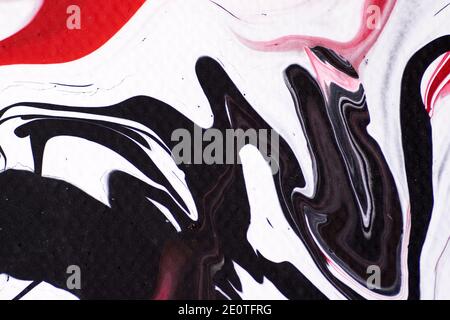 Marbled acrylic colored pattern in the colors red, black, white and pink Stock Photo