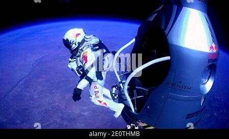 This picture shows pilot Felix Baumgartner of Austria jumping out of the capsule during the final manned flight for Red Bull Stratos on October 14, 2012. The Austrian daredevil became the first man to break the sound barrier in a record-shattering freefall jump from the edge of space, organizers said. The 43-year-old leapt from a capsule more than 24 miles (39 kilometers) above the Earth, reaching a speed of 706 miles per hour (1,135 km/h) before opening his red and white parachute and floating down to the New Mexico desert. Photo by redbullcontentpool/ABACAPRESS.COM Stock Photo
