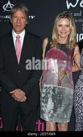 Michelle Pfeiffer and husband David E. Kelly arriving for The 8th Annual Pink Party to benefit Cedars-Sinai Women's Cancer Program, held at Hanger 8 at Santa Monica Airport in Santa Monica, Los Angeles, CA, USA on October 27, 2012. Photo by Baxter/ABACAPRESS.COM Stock Photo