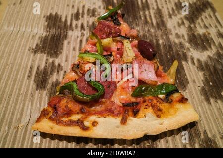 Takeaway pizza slice in cardboard box. Stock Photo