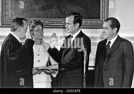 Washington, D.C - February 26, 1971 -- George H.W. Bush is sworn-in as United States Ambassador to the United Nations in Washington, D.C. on February 26, 1971. From left to right: Associate Justice of the United States Supreme Court Potter Stewart, Mrs. George H.W. Bush (Barbara), George H.W. Bush, United States President Richard M. Nixon.Photo by White House/CNP/ABACAPRESS.COM Stock Photo