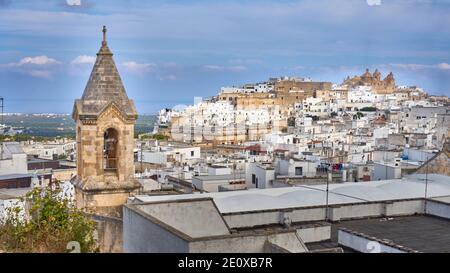 View of the old white town of Ostuni and the cathedral at sunrise. Brindisi, Apulia in southern Italy. Europe. Stock Photo