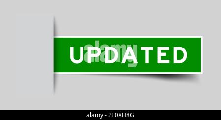 Inserted green color sticker label with word updated on gray background Stock Vector